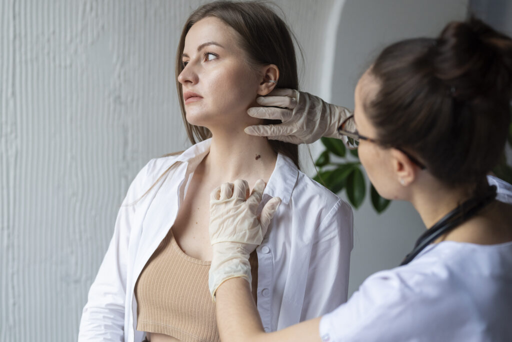 Woman receiving professional skin check from dermatologist in New Zealand