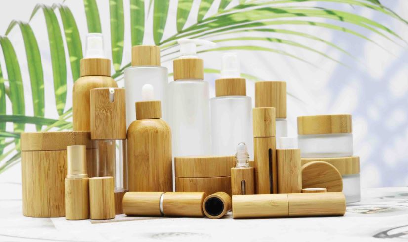 Eco skincare bottles and bamboo packaging on a white surface – clean beauty concept in New Zealand
